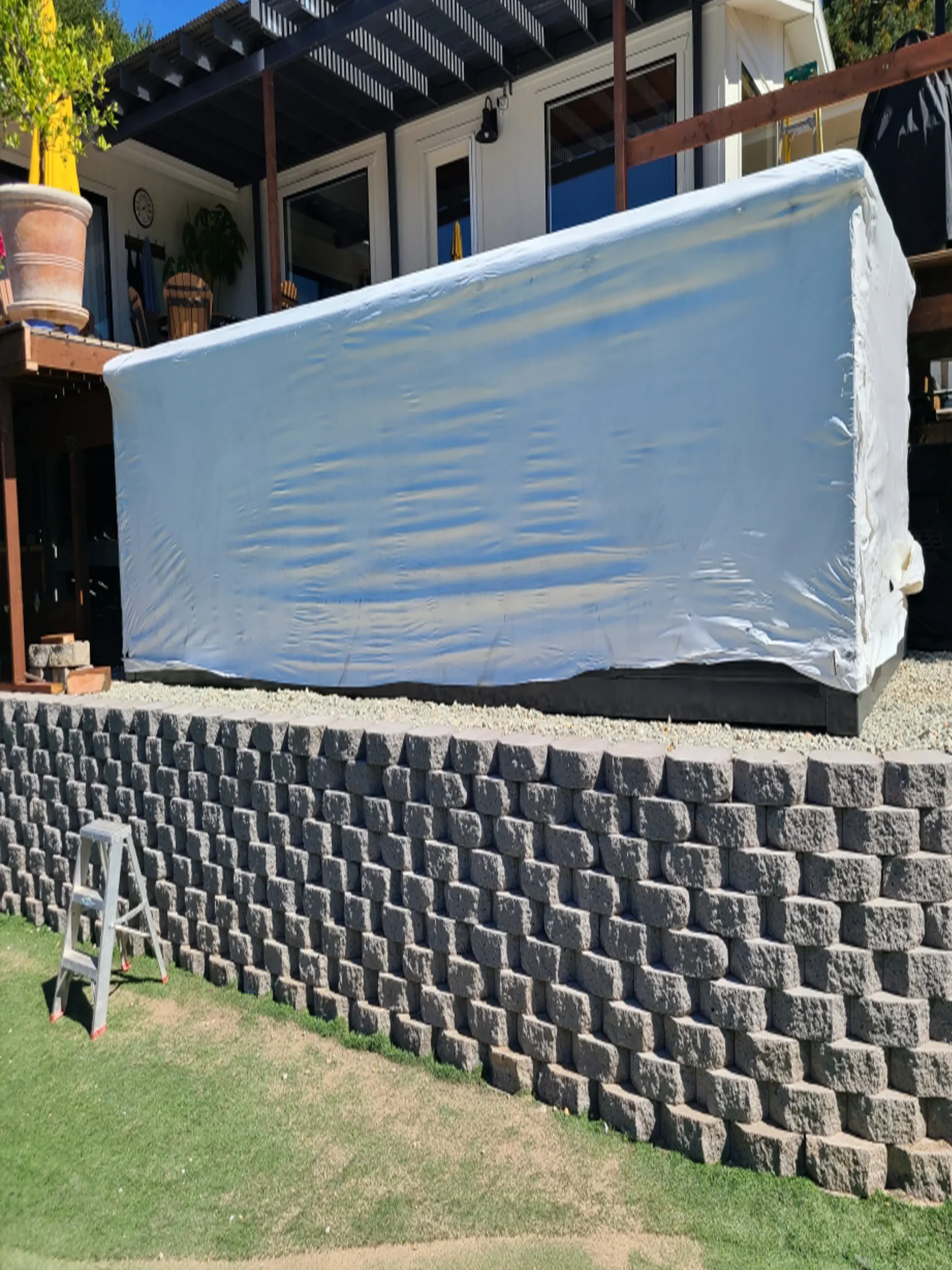 Container pool wrapped in protective plastic on site before installation