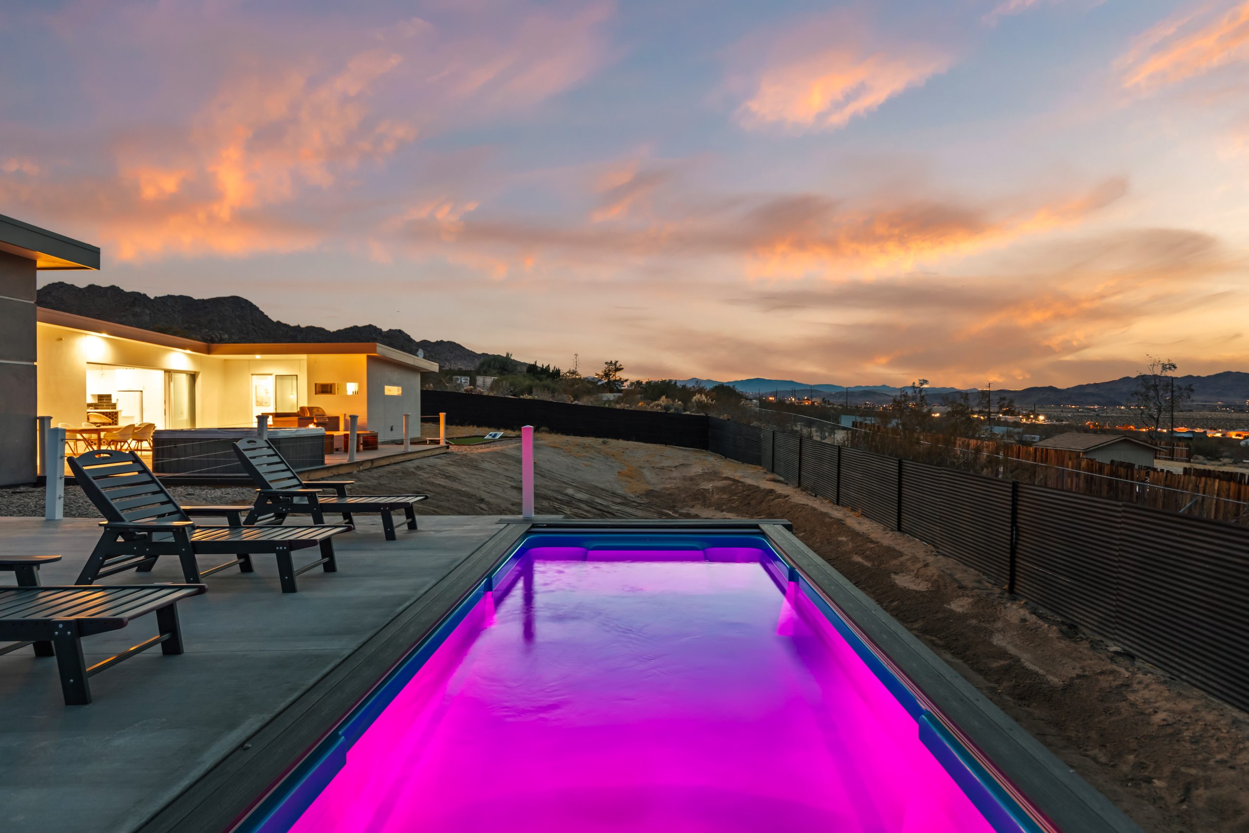 ContainUR container pool with LED color lighting at night