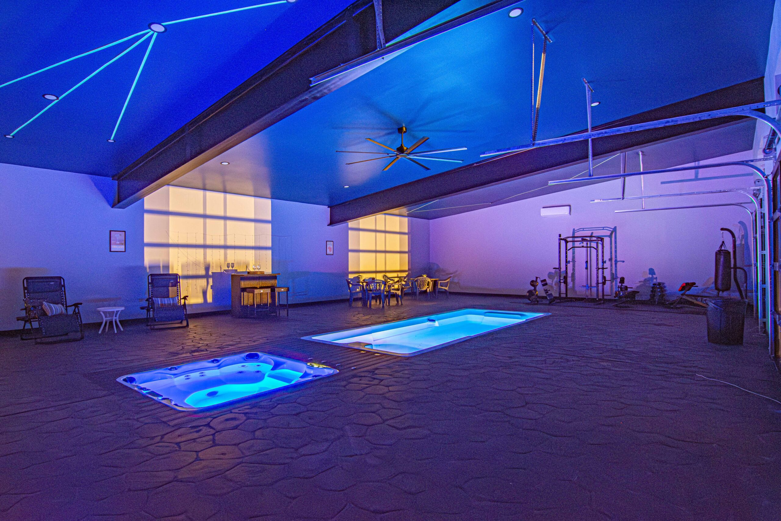 ContainUR container pool installed in-ground inside indoor pool house
