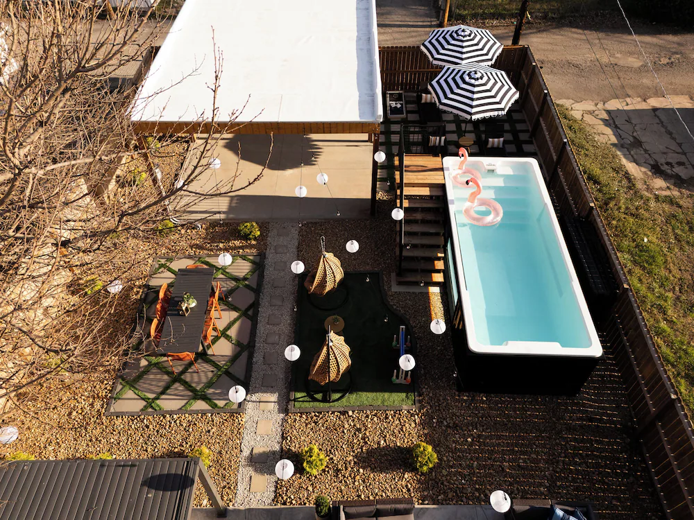 Overhead view of a St. Louis backyard with container pool, shade canopy and turf